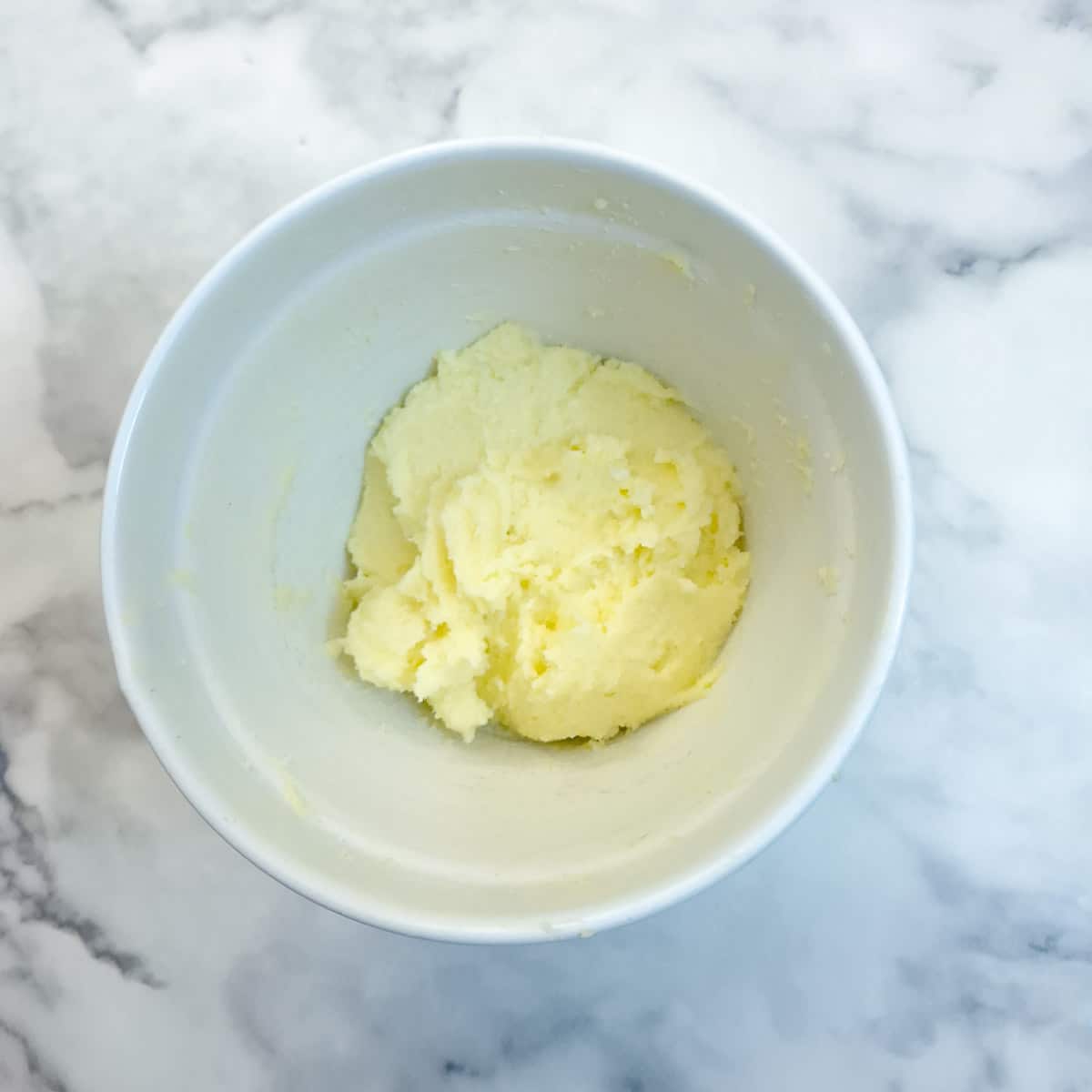 Step 8 - Eggs and sugar being combined in a mixing bowl to make frangipane.