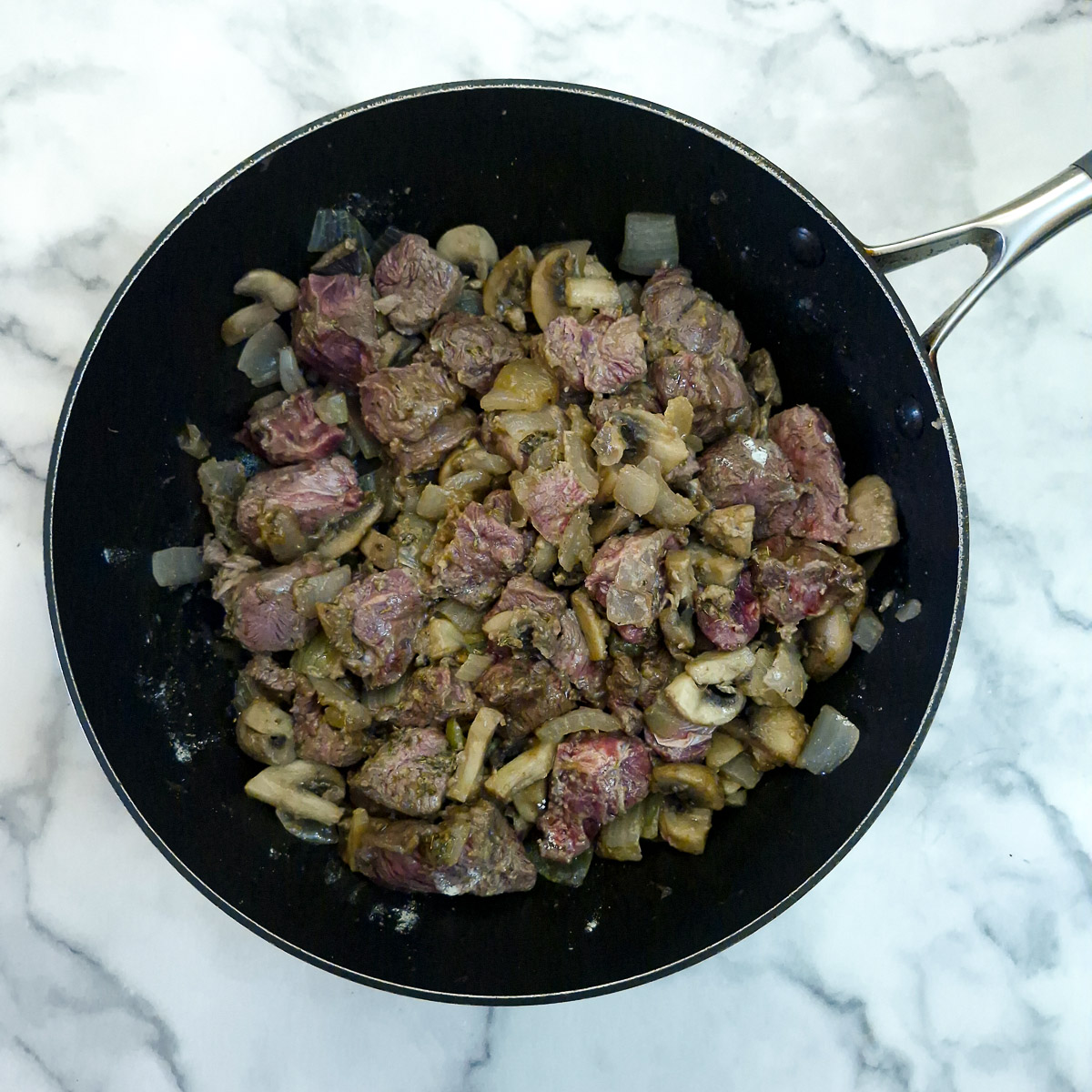 Step 4 - diced shin been added to the pan and allowed to take on a little colour.