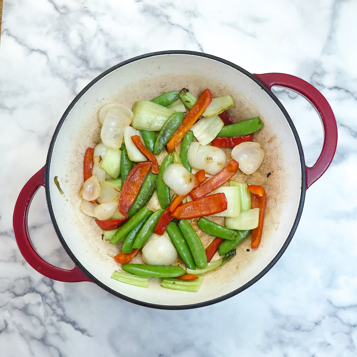 Step 2 - Sugar snap peas added to the vegetables to soften.