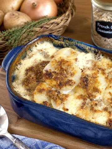 French onion potato bake in a blue baking dish.