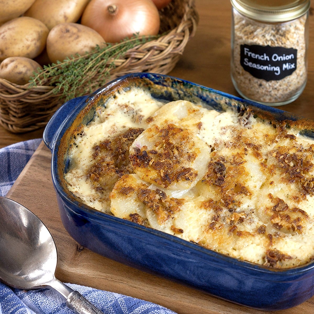 French onion potato bake in a blue baking dish.
