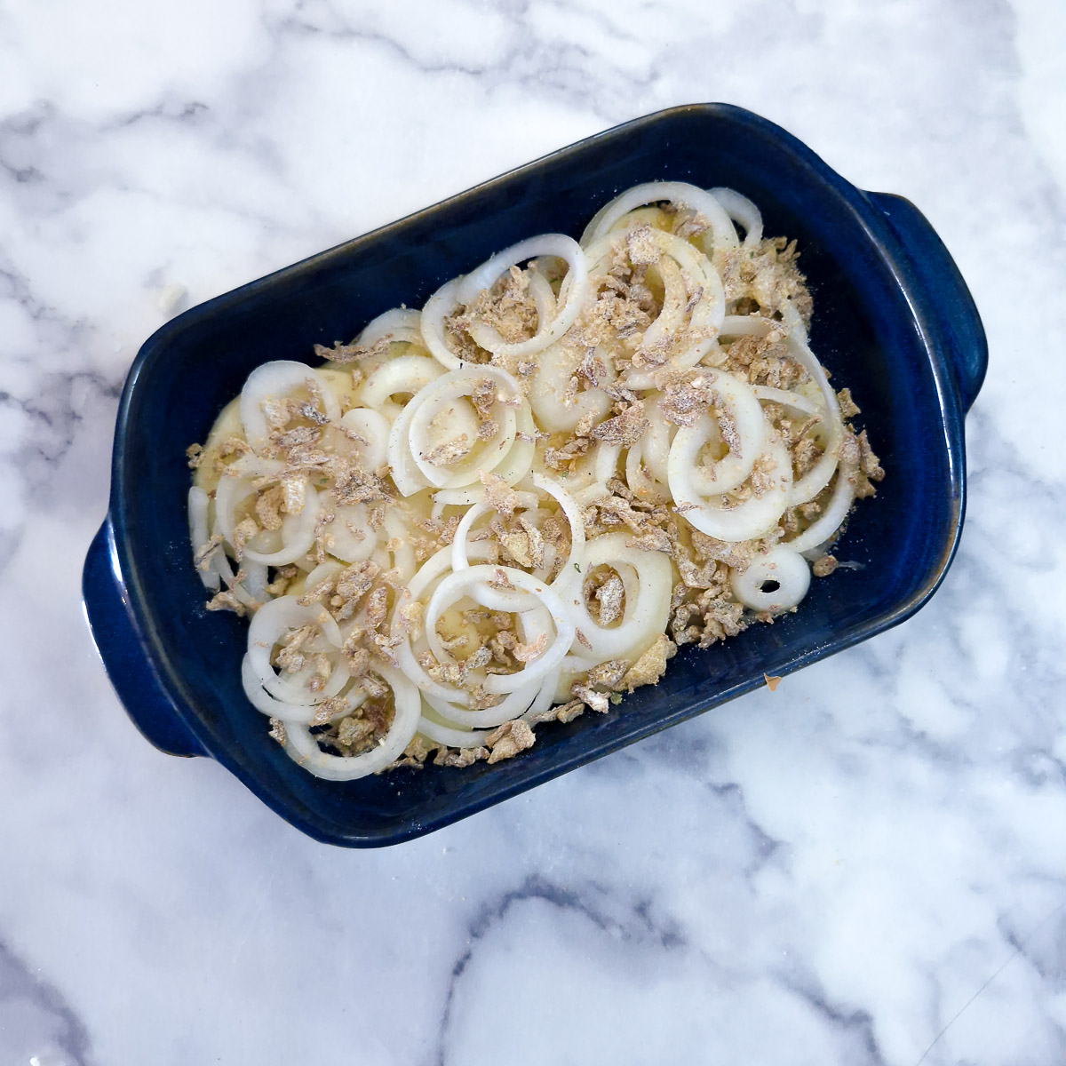Step 3 - French onion seasoning mix sprinkled over potatoes and onions.