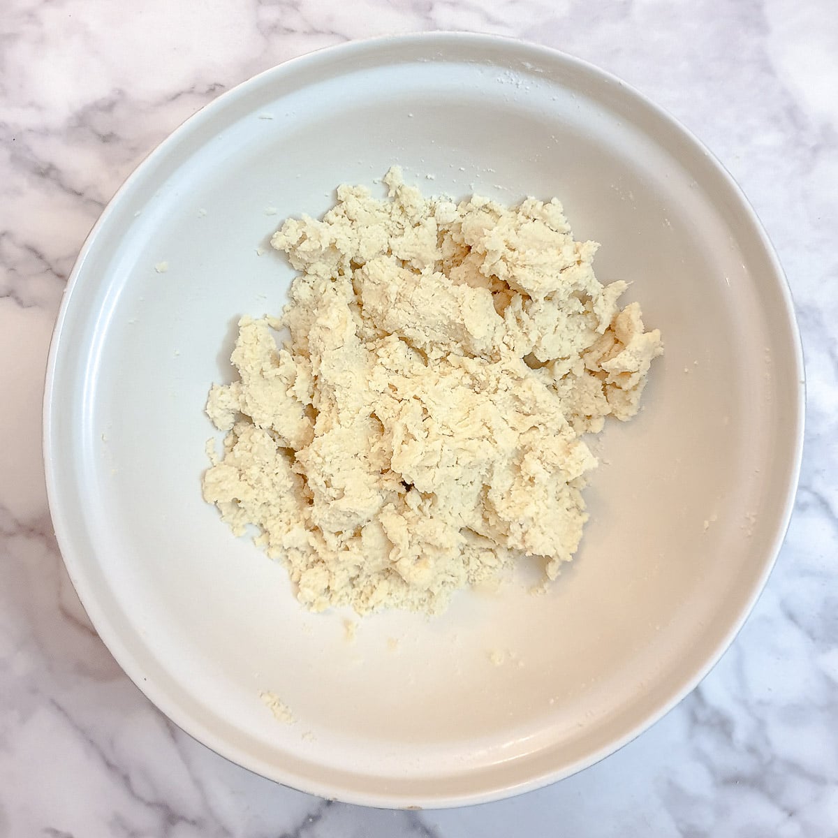 Step 3 - water combined with the flour and butter to make a shaggy dough.