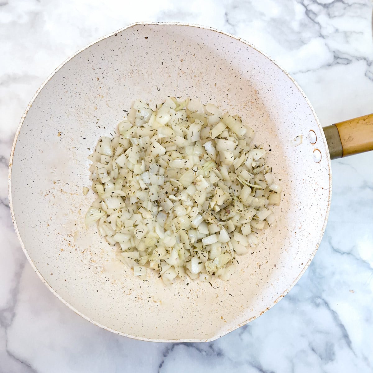 Step 4 - onions, dried thyme and garlic softening in a wok.